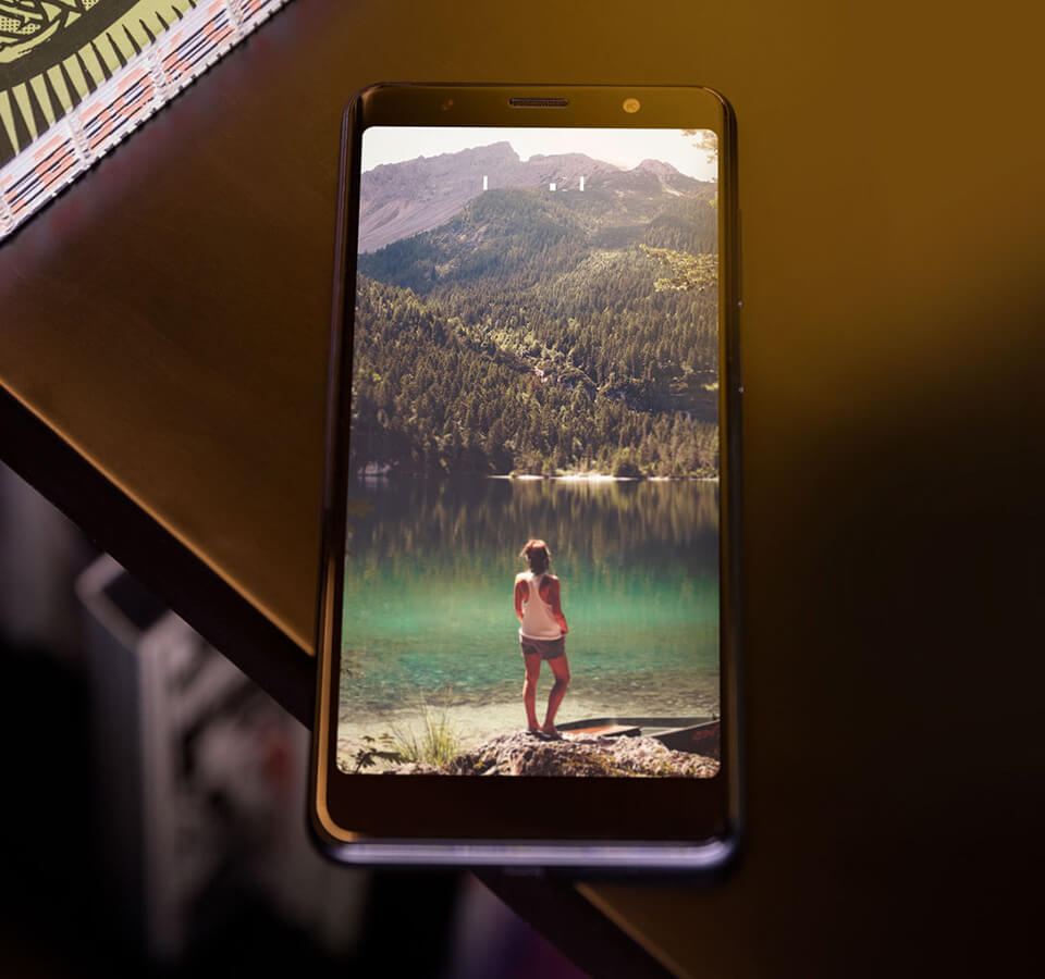 VIEW LITE dislpayed on wood table, mountain landscape in the background